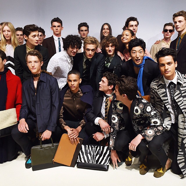 Models pose backstage at Burberry Prorsum's spring-summer 2016 show.