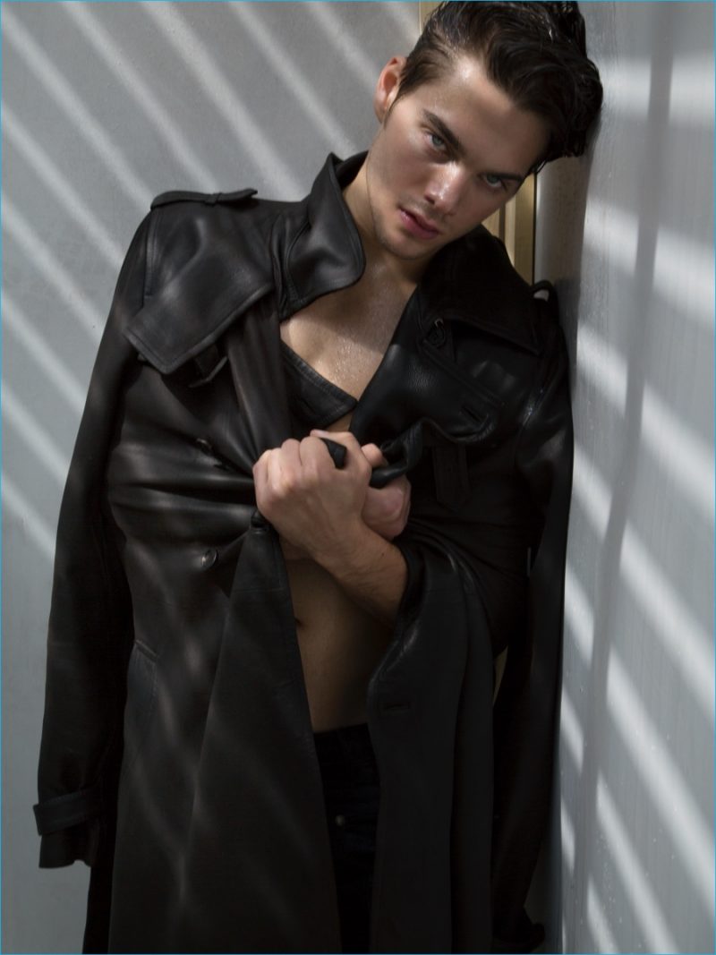 Dylan Sprayberry dons a leather Miu Miu coat with Dsquared2 trousers.