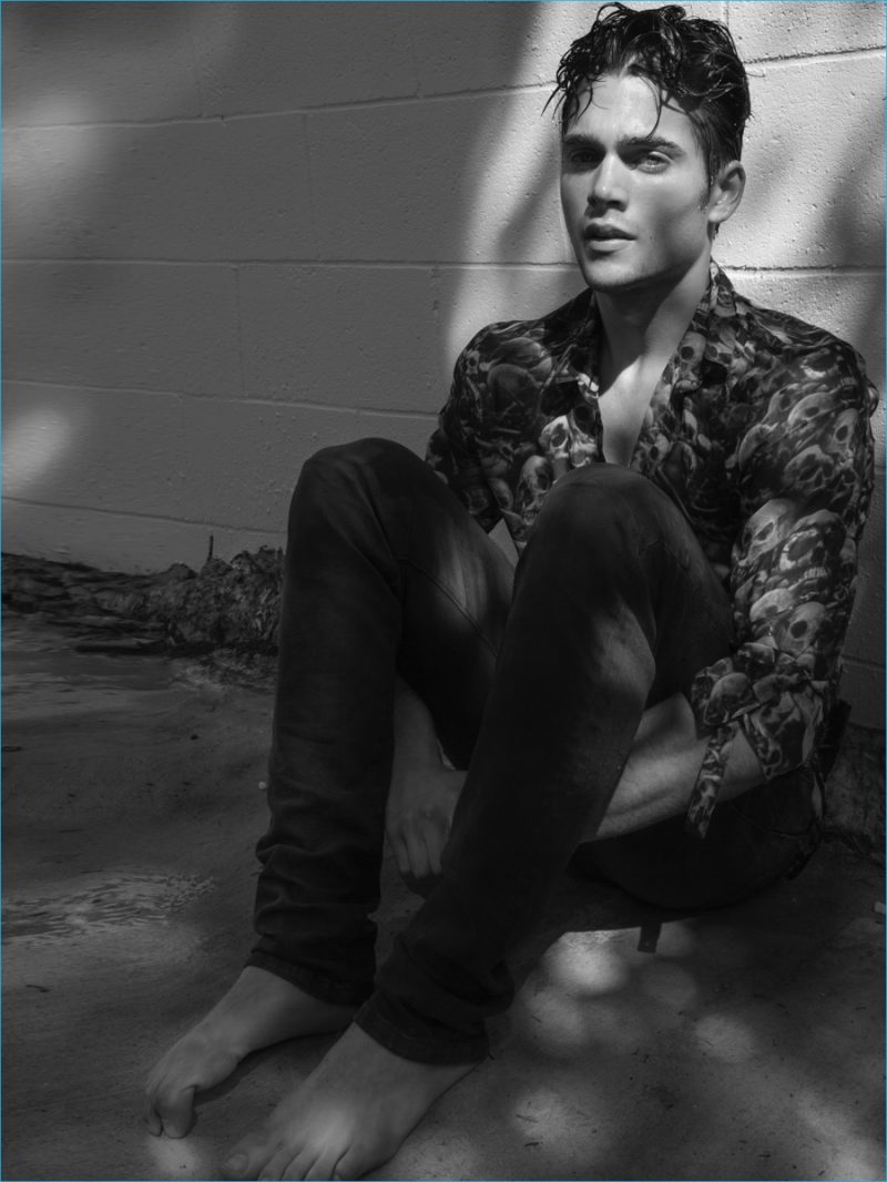 Dylan Sprayberry snapped in a skull print shirt with Eight Field of Freedom jeans.