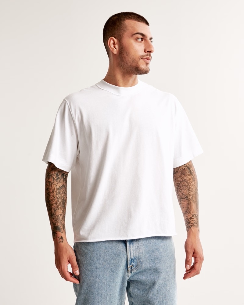 A vintage-inspired cropped tee brings subtle refinement to a laid-back classic.