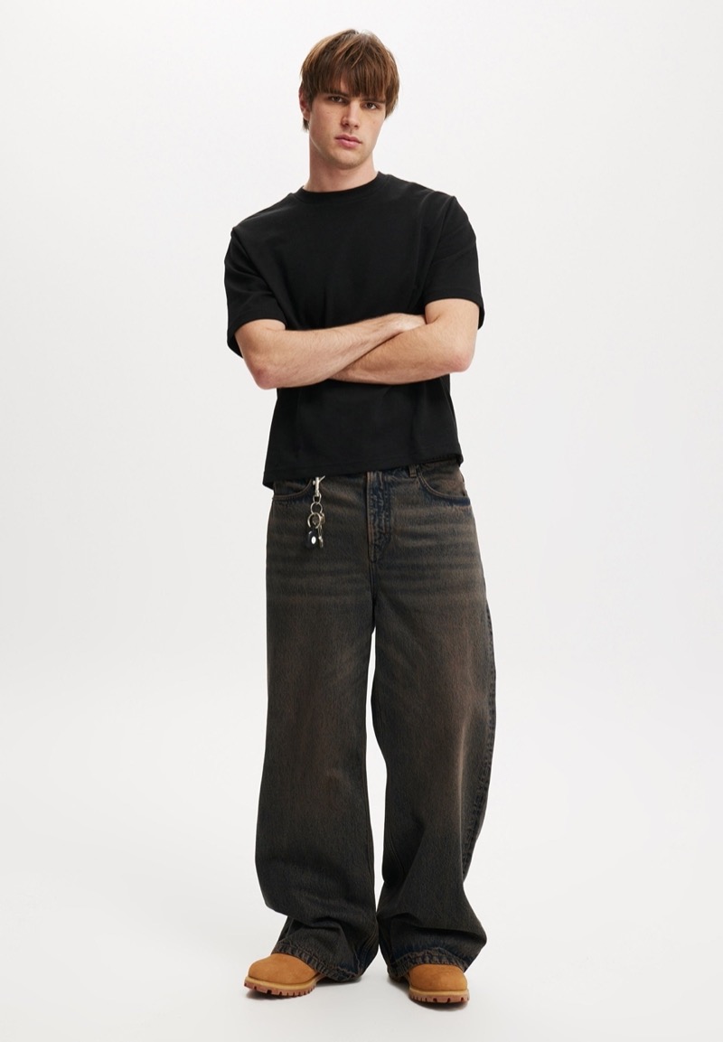 A black cropped tee keeps the fit grounded while letting the proportions do the talking.