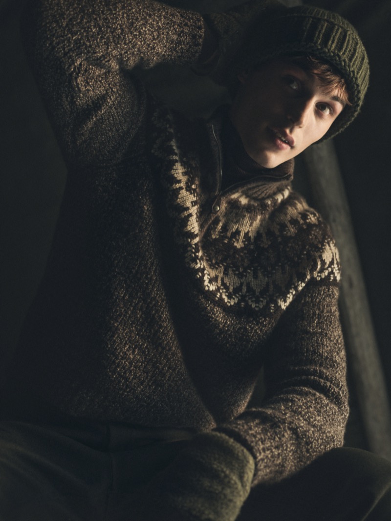 Kit Butler wears a knit 3/4 pullover with a Norwegian-inspired jacquard pattern. 