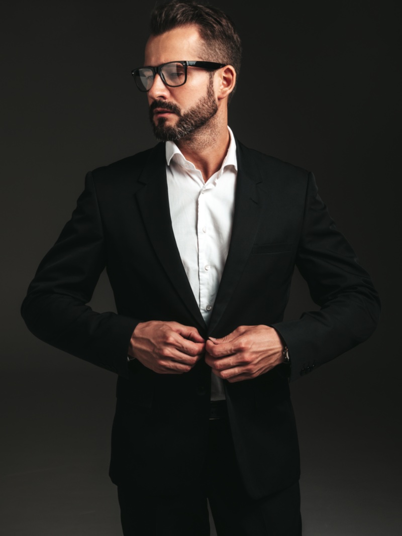 Buttoning the Jacket Male Model Pose