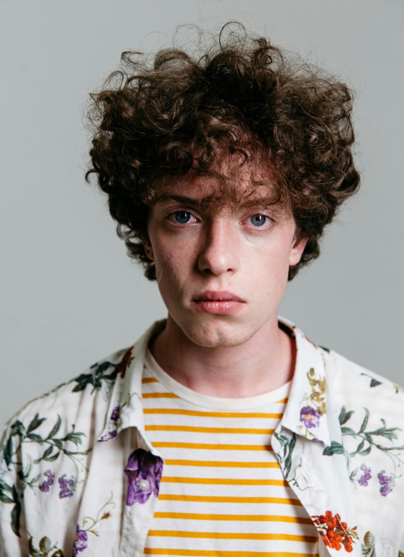 male model headshot curly hair