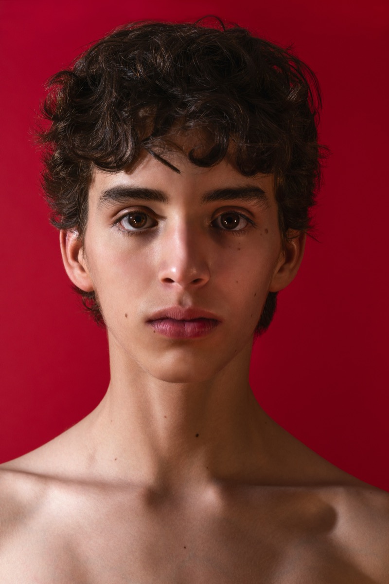 male model headshot red background