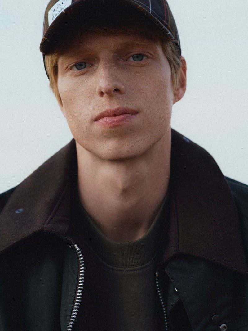 Joseph Uyttenhove wearing a cap and a waxed jacket with a contrasting collar for Barbour x A.P.C.