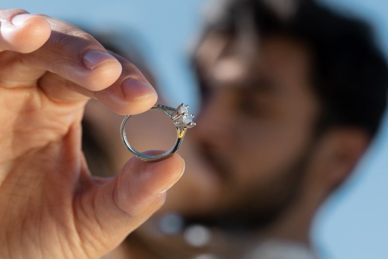 Man holding engagement ring