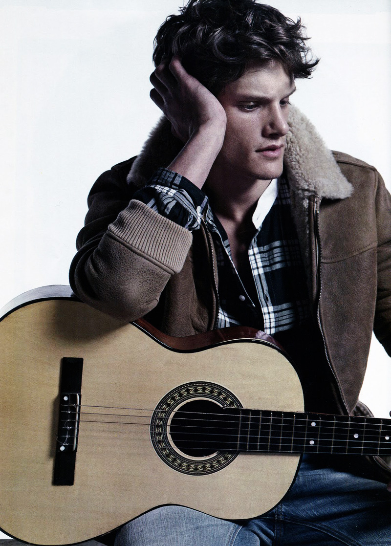 Danny Beauchamp poses with a guitar for L'Officiel Hommes