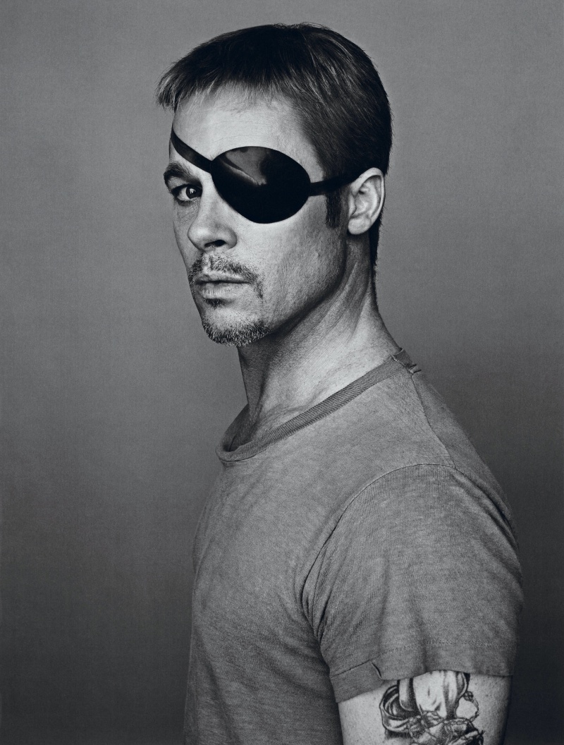 Brad Pitt wears a Kaufman's Army & Navy t-shirt with an Atsuko Kudo eye patch. 