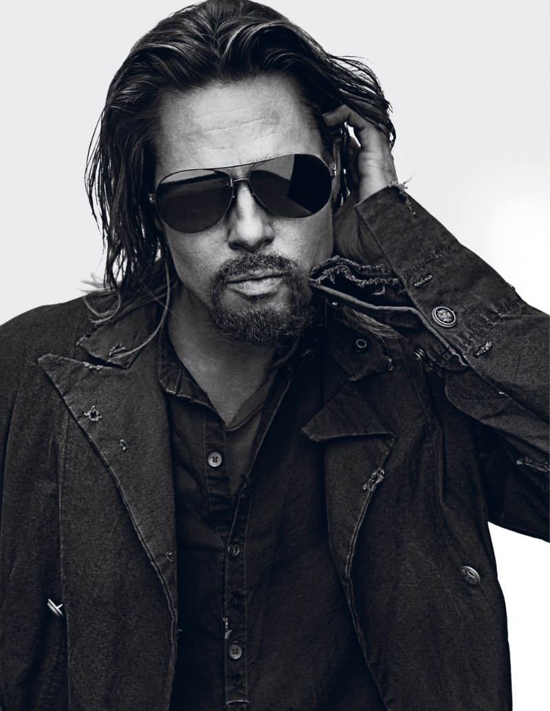Brad Pitt shows off his long hair as he wears a shirt and jacket by Greg Lauren with a Topman t-shirt. 