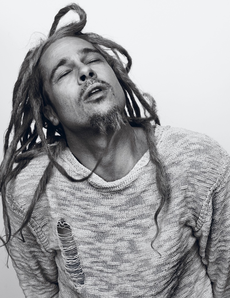 Rocking dreads, Brad Pitt wears A Child of the Jago sweater. 