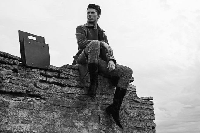 Kristjan wears coat and trousers Kalle HT and briefcase Scheckmann.