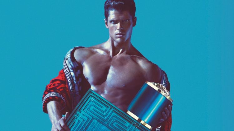 Brian Shimansky poses in an open robe as the face of the Versace Eros fragrance campaign for men.