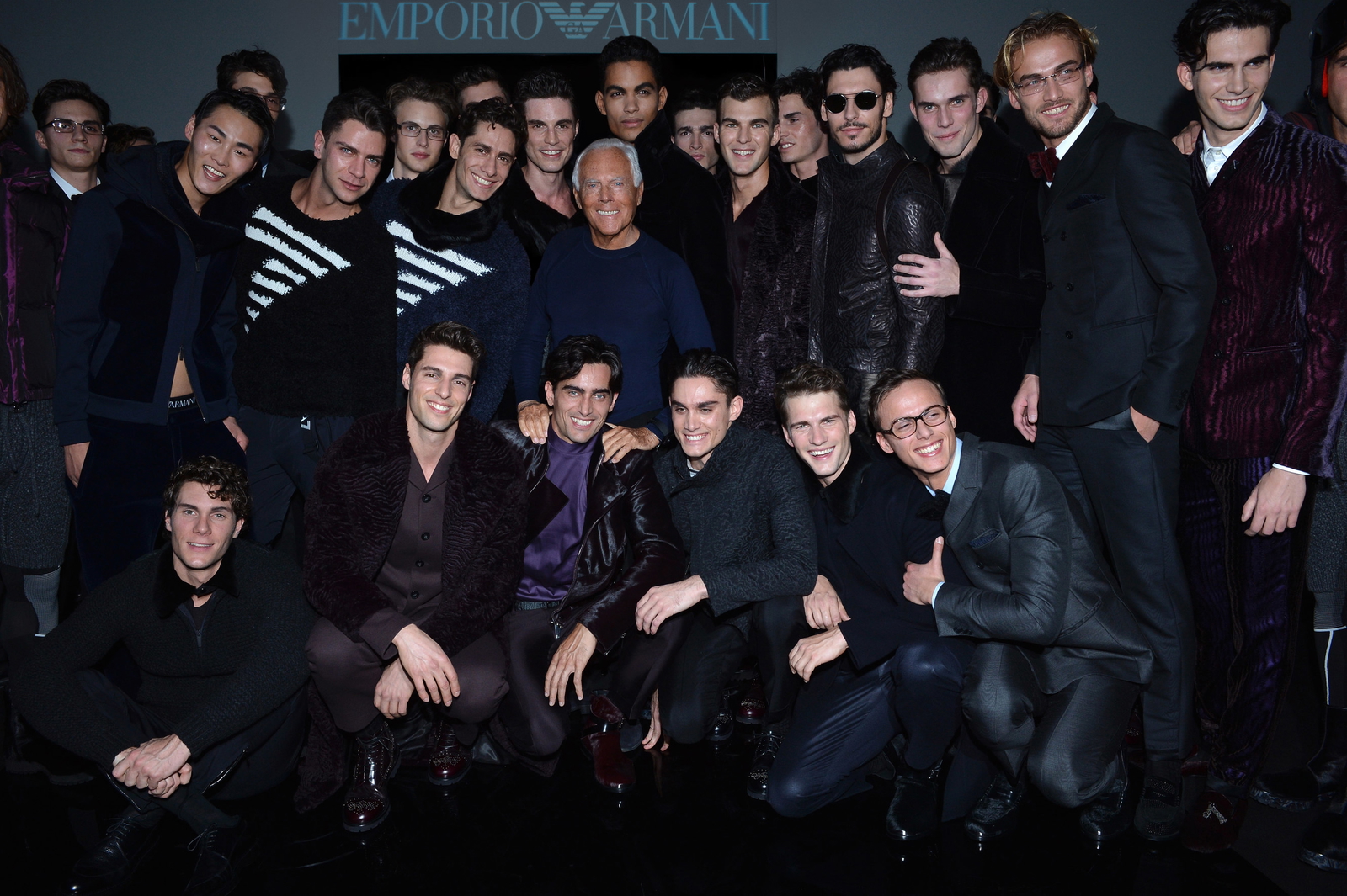 Giorgio Armani with models