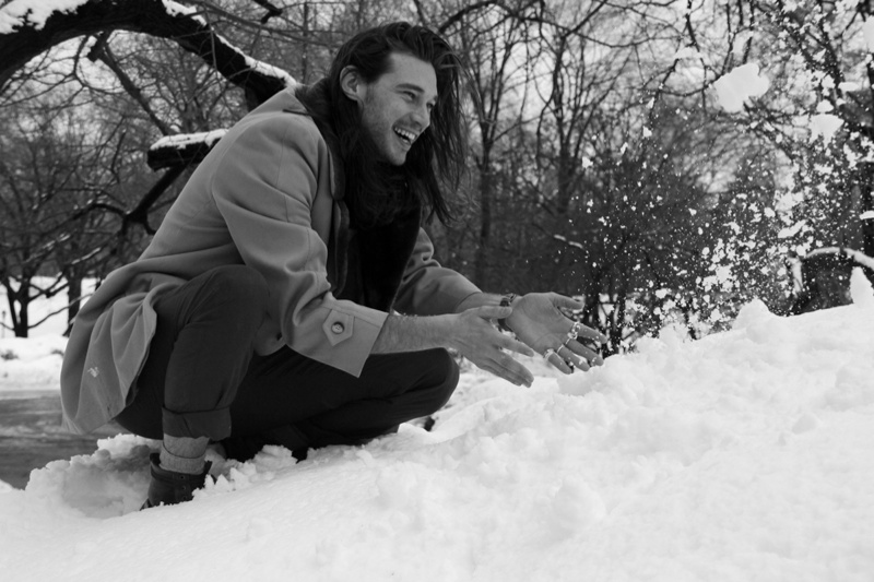 striking figura serpentina pose amidst snow-clad trees signifying winter  serenity