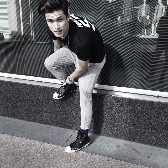 Charles Melton poses for a spontaneous image.