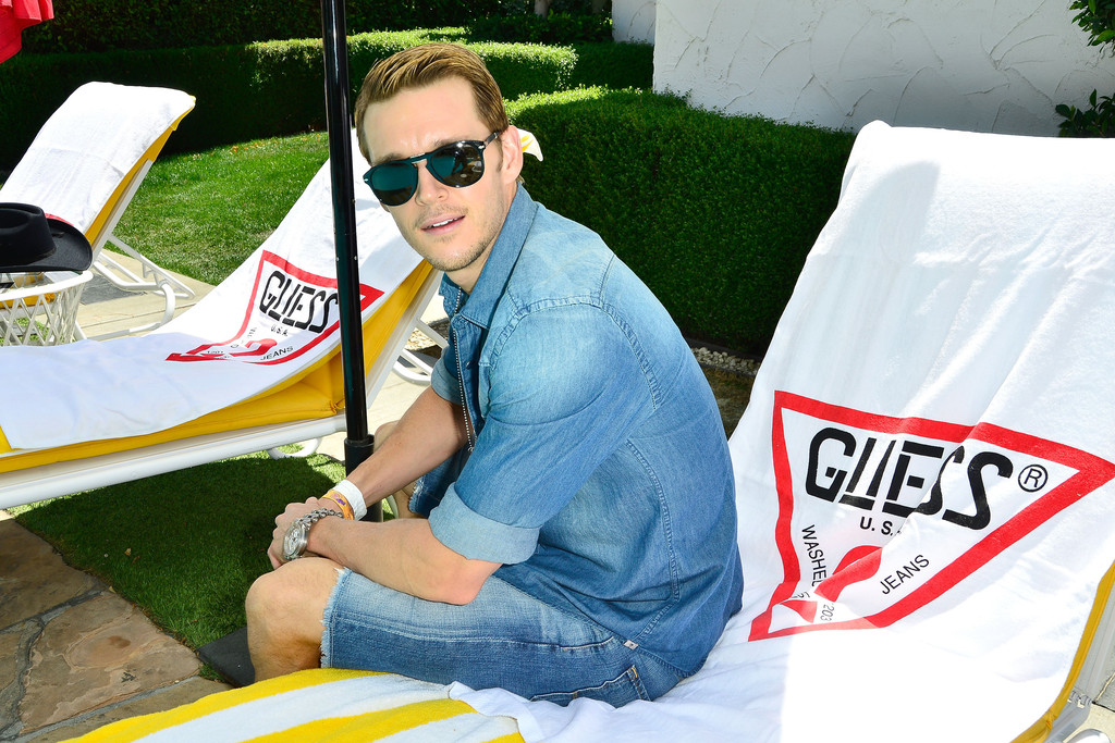 Simple Statement: Let your denim shirt do the heavy lifting. If you're committed to your denim on denim look, why not celebrate it. Here, actor Ryan Kwanten sports his denim shirt with the top buttons left undone. His shirt is then paired with denim shorts for a relaxed summer ensemble.