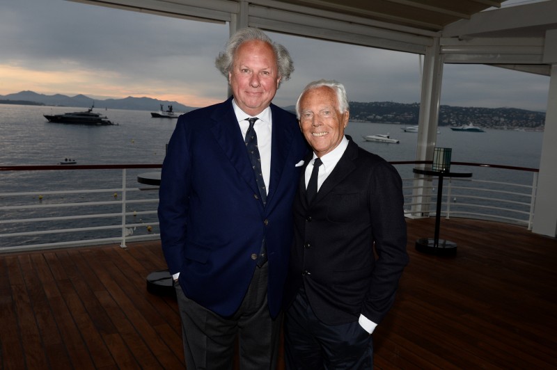 Co-hosts for the evening, designer Giorgio Armani poses with Vanity Fair editor-in-chief Graydon Carter