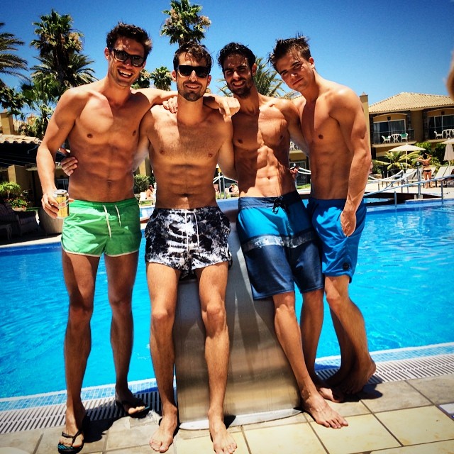 Antonio Navas, Jabel Balbuena, River Viiperi and Juan Betancourt pose poolside.