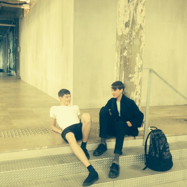 Models relax behind the scenes of Carven's Parisian show.