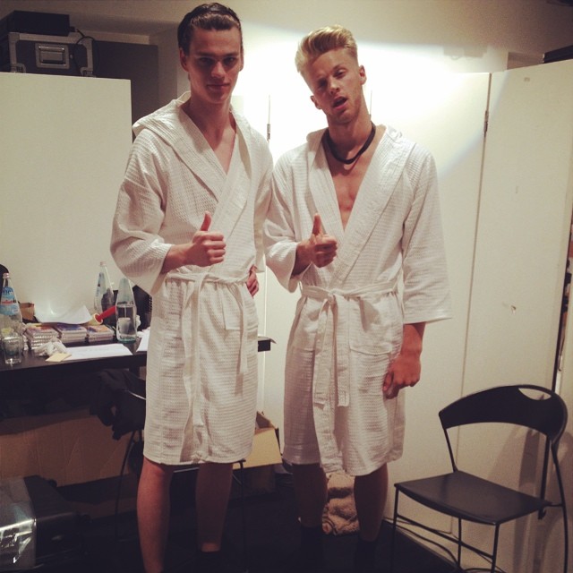 Filip Hrivnak and Clark Bockelman pose together in their robes behind the scenes.