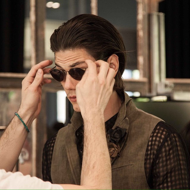 Model Simone Nobili gets new shades at John Varvatos' show during Milan Fashion Week.