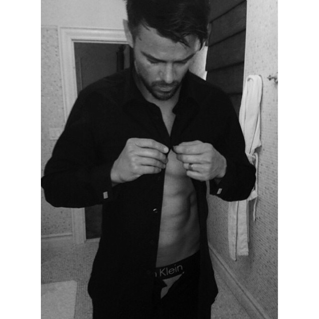 Josh Duhamel undresses after the amfAR gala.