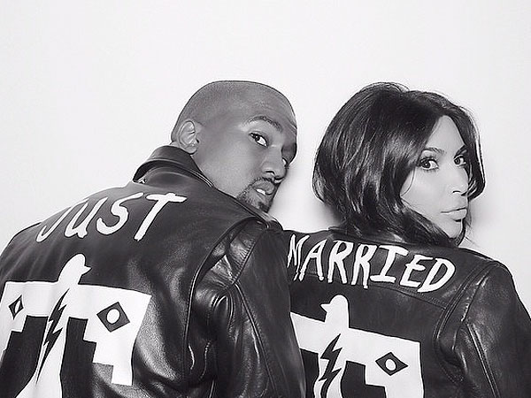 Kanye West and Kim Kardashian in BLK DNM 'Just Married' jackets.