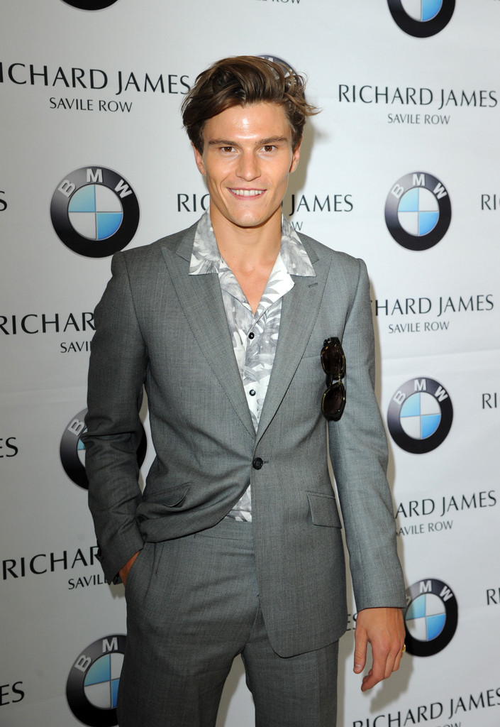 A man of style, model Oliver Cheshire impressed during London Collections: Men wearing a suit from Reiss with a printed shirt from Zara.