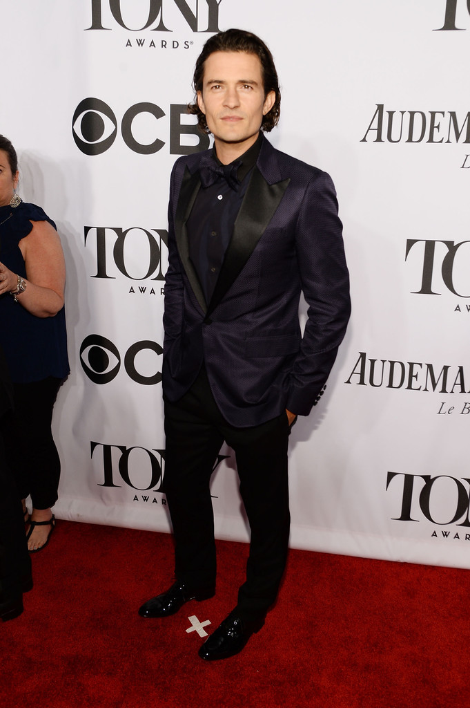 Actor Orlando Bloom achieves a suave approach to the suit with a little sheen.
