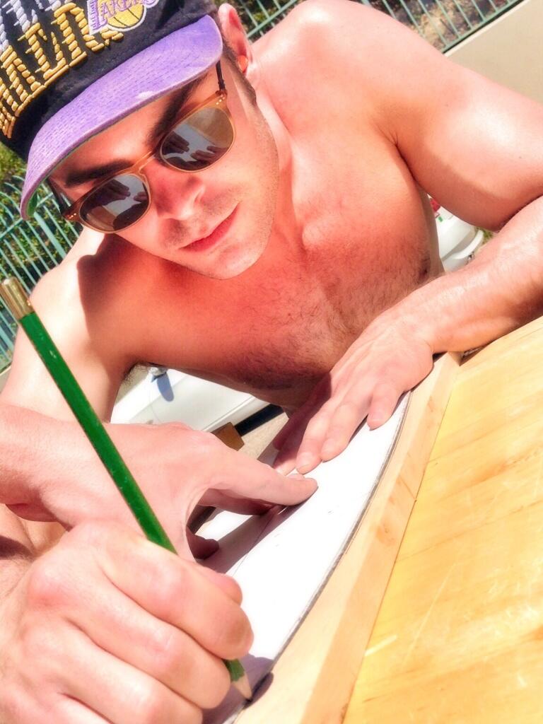 Zac-Efron-Shirtless-Lakers-Cap-2014-skateboard