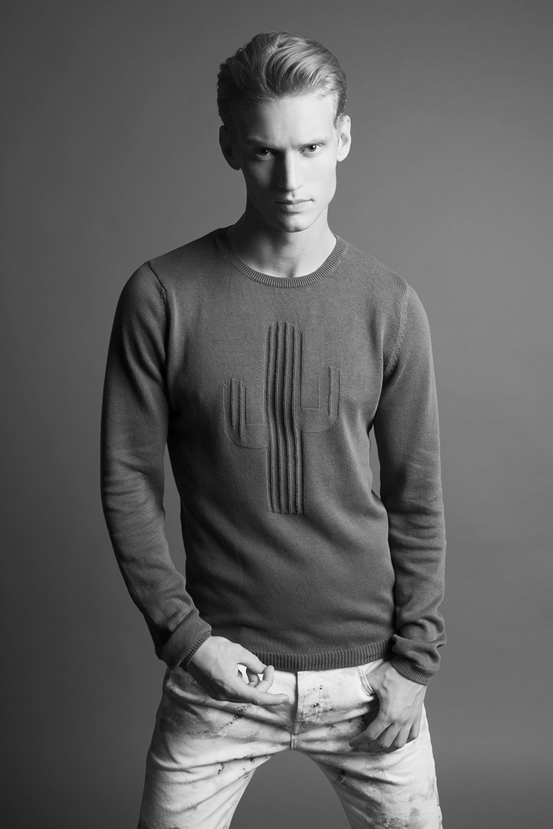 Alexander wears sweater Zara and  jeans McQ by Alexander McQueen.