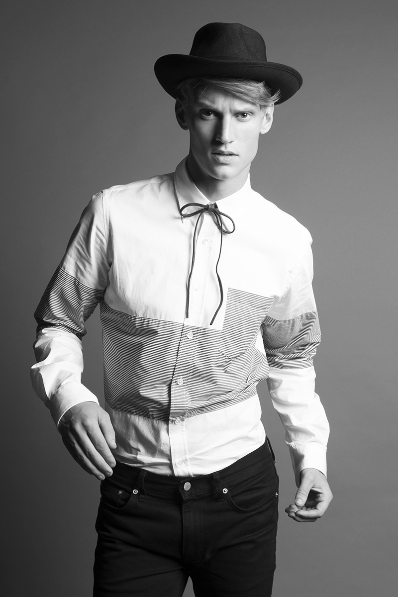 Alexander wears Shirt Timo Weiland, jeans BLK DNM and hat The Kooples.