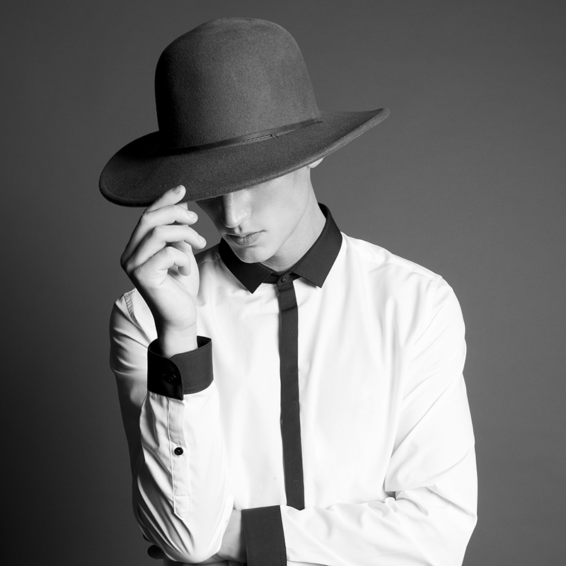 Alexander wears shirt Topman, and hat Brixton.