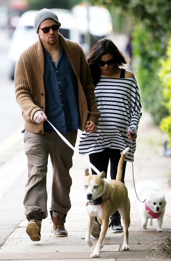 Channing Tatum and then pregnant wife Jenna Dewan-Tatum take their dogs for a walk in May 2013.