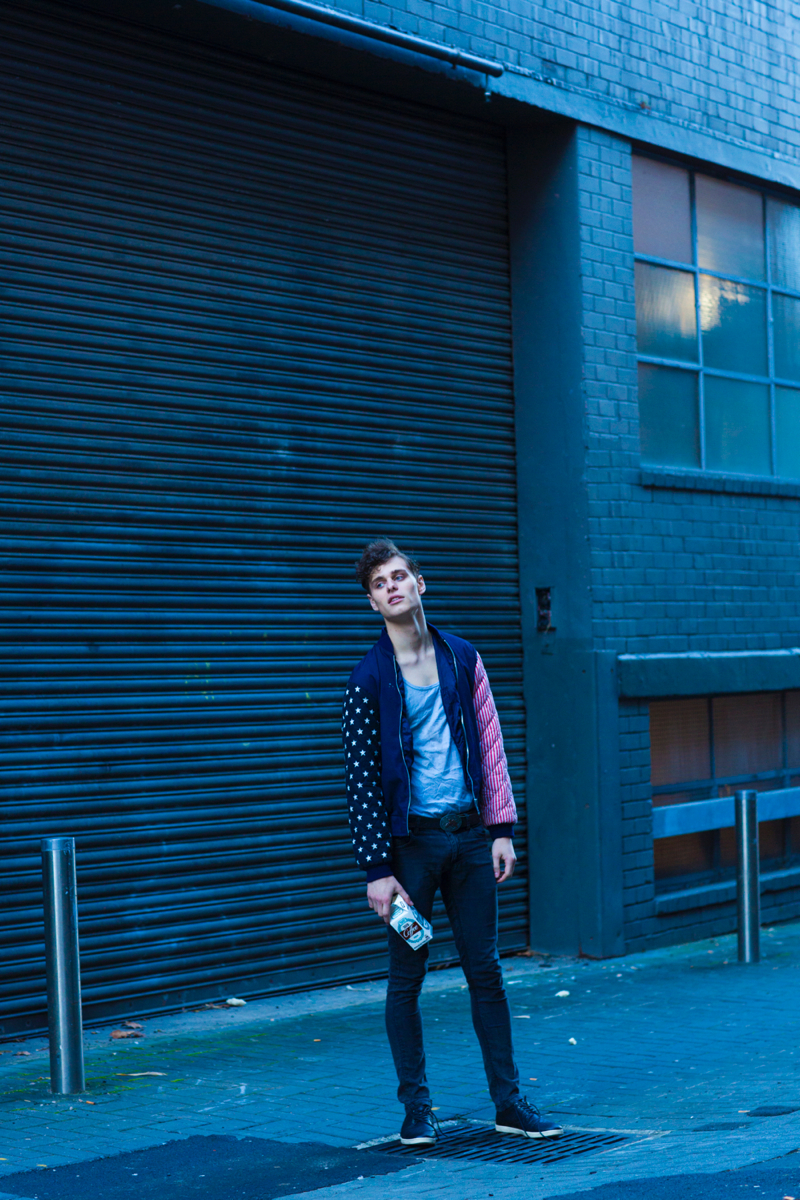 Ethan wears vintage jacket stylist's own, tank Neuw, jeans Levi's and shoes model's own.