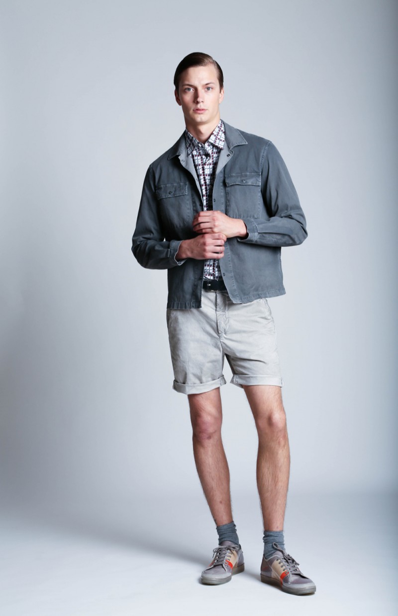 Linus wears shirt and belt Brioni, jacket and shorts Dondup.