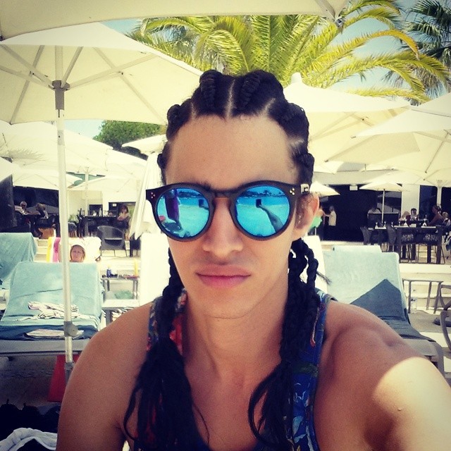 Luis Borges relaxes poolside with his fresh new braids