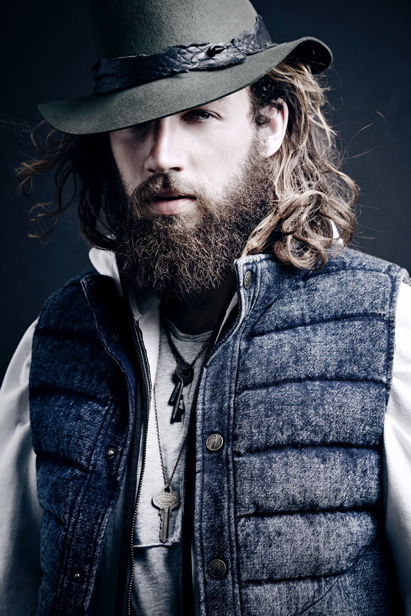 Phil wears t-shirt and hooded sweater Daniel Patrick, denim down vest Matiere and hat Lor-e Philips.