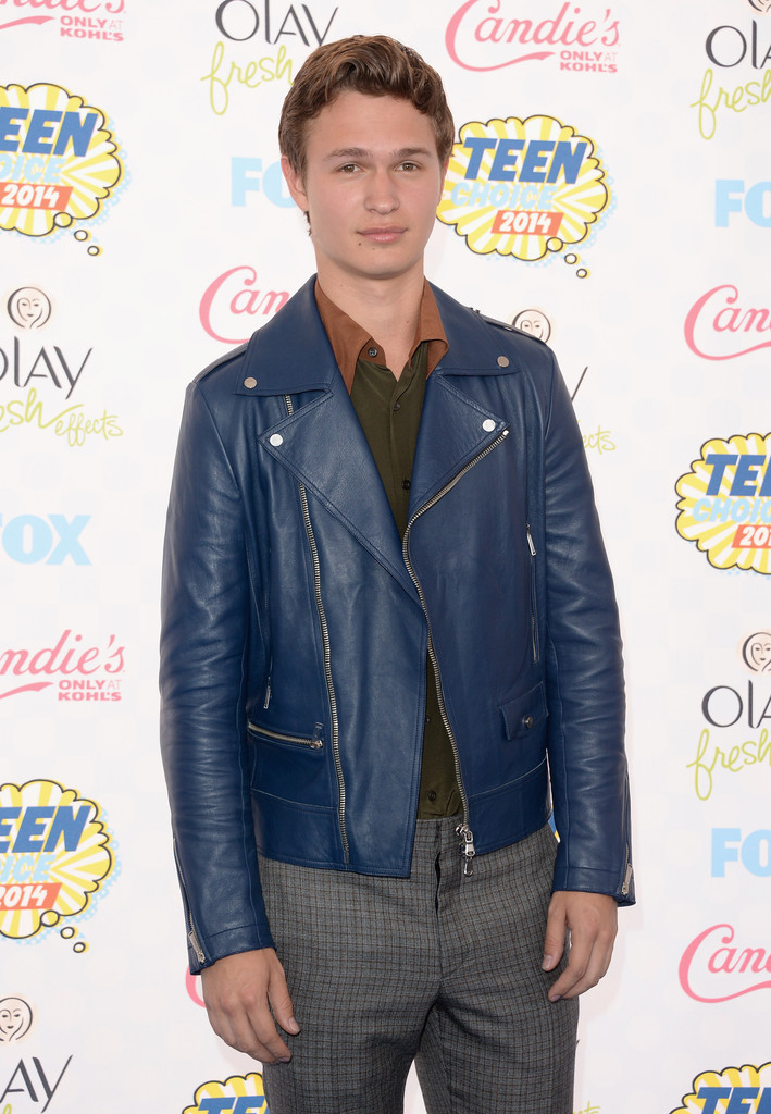 'Fault in Our Stars' actor Ansel Elgort pairs a Prada autumnal hued dress shirt with a blue leather's biker jacket and plaid pants.