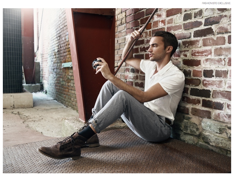 Clement wears white shirt XOOS, pants Scotch & Soda, belt stylist's own and boots Zara.