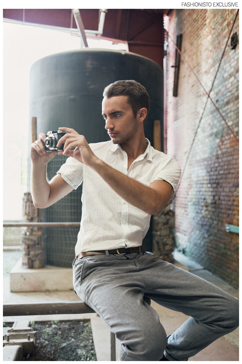 Clement wears white shirt XOOS, pants Scotch & Soda and belt stylist's own.