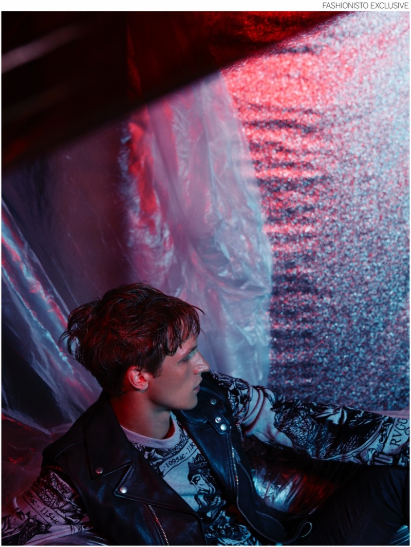 Andreas wears Ruggero II flocked cotton sweatshirt DOLCE & GABBANA, matte leather biker vest SAINT LAURENT BY HEDI SLIMANE and tartan wool flannel trousers by ALEXANDER MCQUEEN