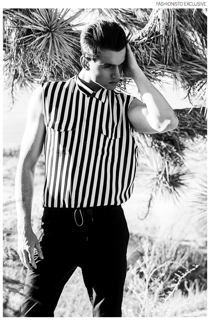 Jonathan wears shirt Saint Laurent by Hedi Slimane and pants Zara.