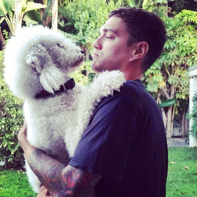 Josh Beech cozies up to man's best friend.