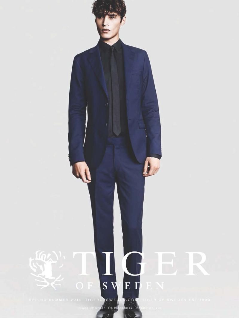 Adrien Sahores models a navy and black suiting look for Tiger of Sweden's spring-summer 2014 campaign.