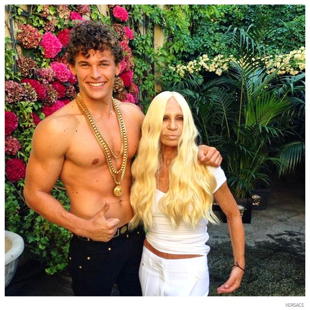 Donatella Versace poses with model Maximilian Wefers.