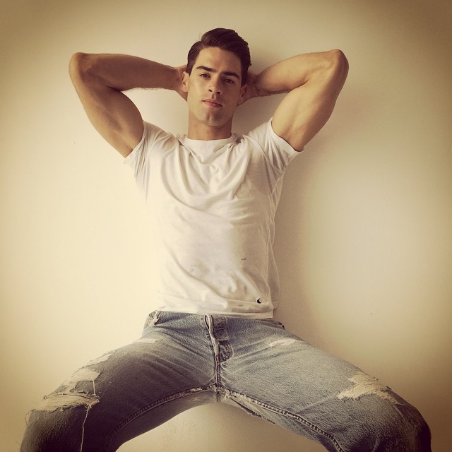 Chad White poses in a simple tee and pair of jeans.