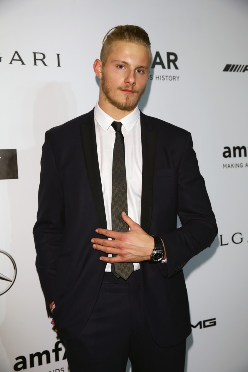 Attending the sixth annual amfAR Milano Gala during Milan Fashion Week on September 20, 2014, 'Vikings' actor and Bulgari brand ambassador, sported the label's OCTO watch in stainless steel with a black alligator strap. The luxurious timepiece went well with a slim-fit, sharp tailored, black suit.