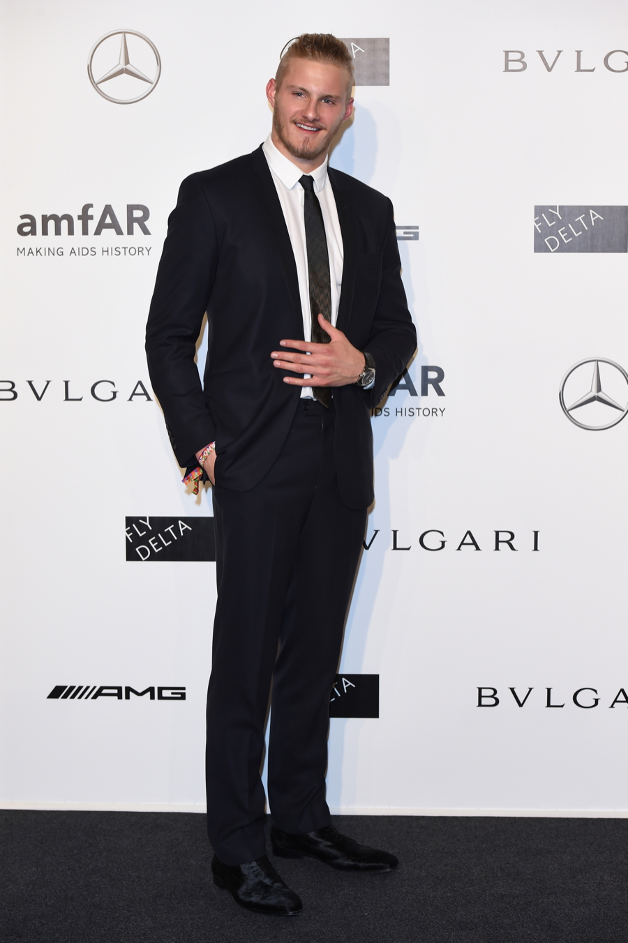 Alexander Ludwig Wears Bulgari to amfAR Milano Gala